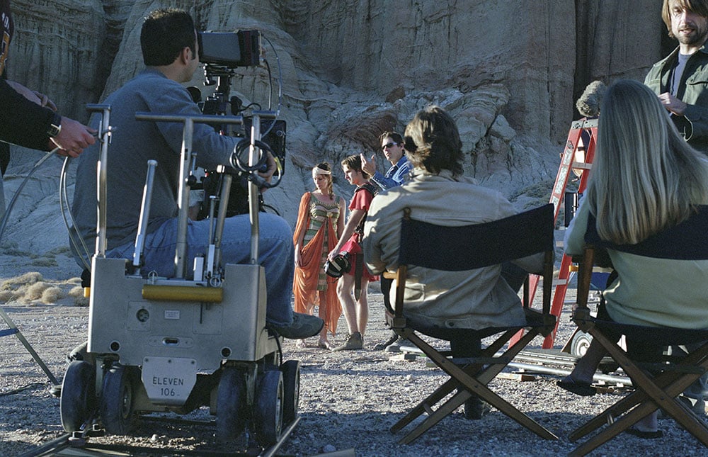 Director on a film set speaking with actors