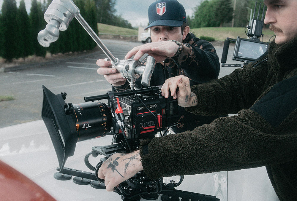 Camera assistant fixing camera to car