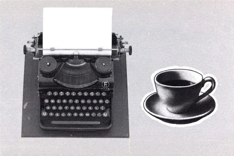 vintage typewriter with a blank sheet of paper next to an illustrated coffee cup