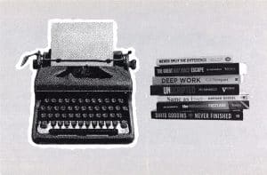 vintage typewriter next to stack of books